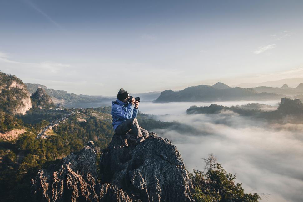 Free Image of Person Taking Picture of Mountain 