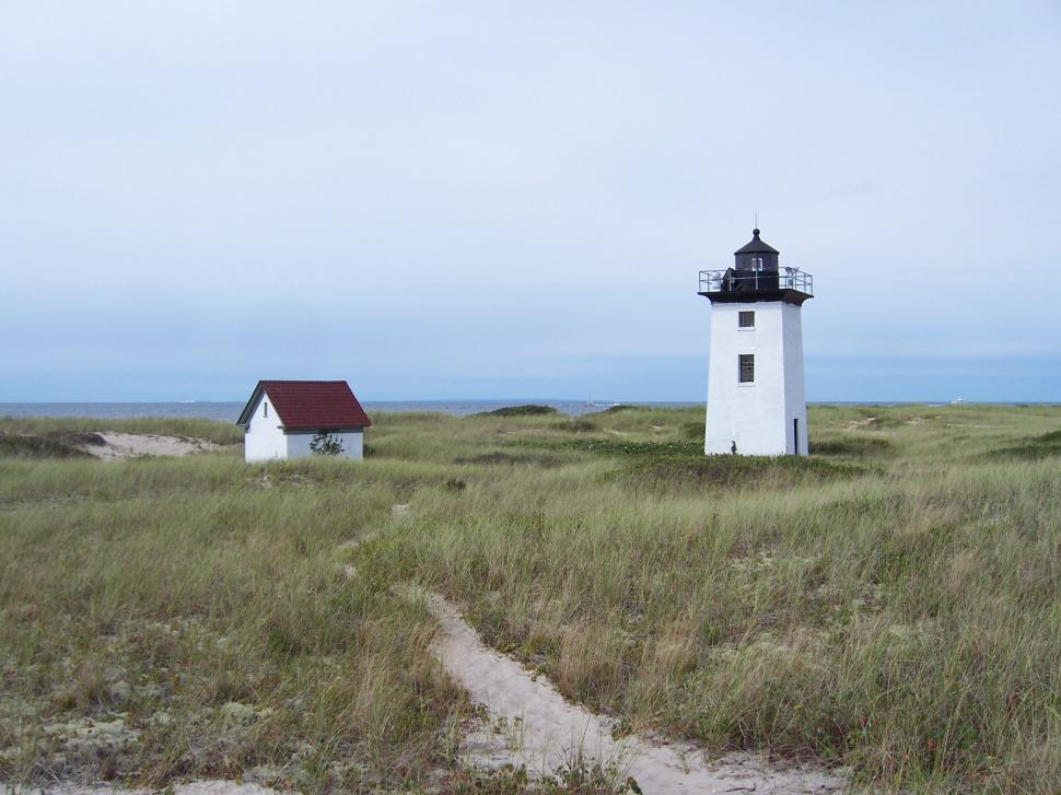 Free Image of light house and small house 