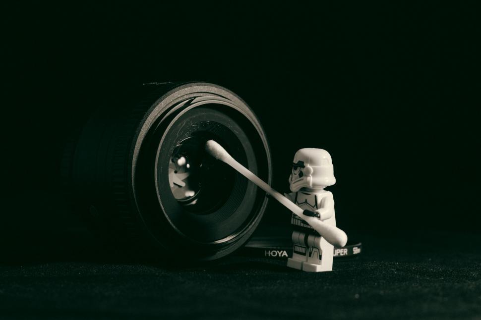 Free Image of Lego Figure Standing Next to Tire 