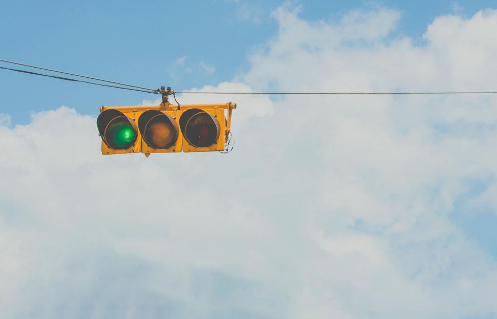 Free Image of Traffic Light Suspended in Sky 