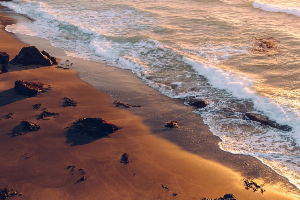 Free Image of Waves Rolling Onto Sandy Beach 
