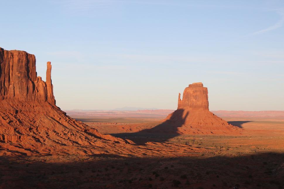 Free Image of Massive Rock Formation Amid Desert Landscape 