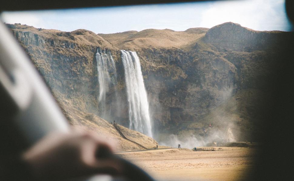 Free Image of Waterfall View From Inside Vehicle 