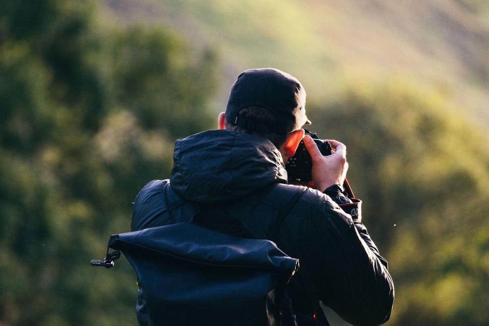 Free Image of Man Photographing Mountain 