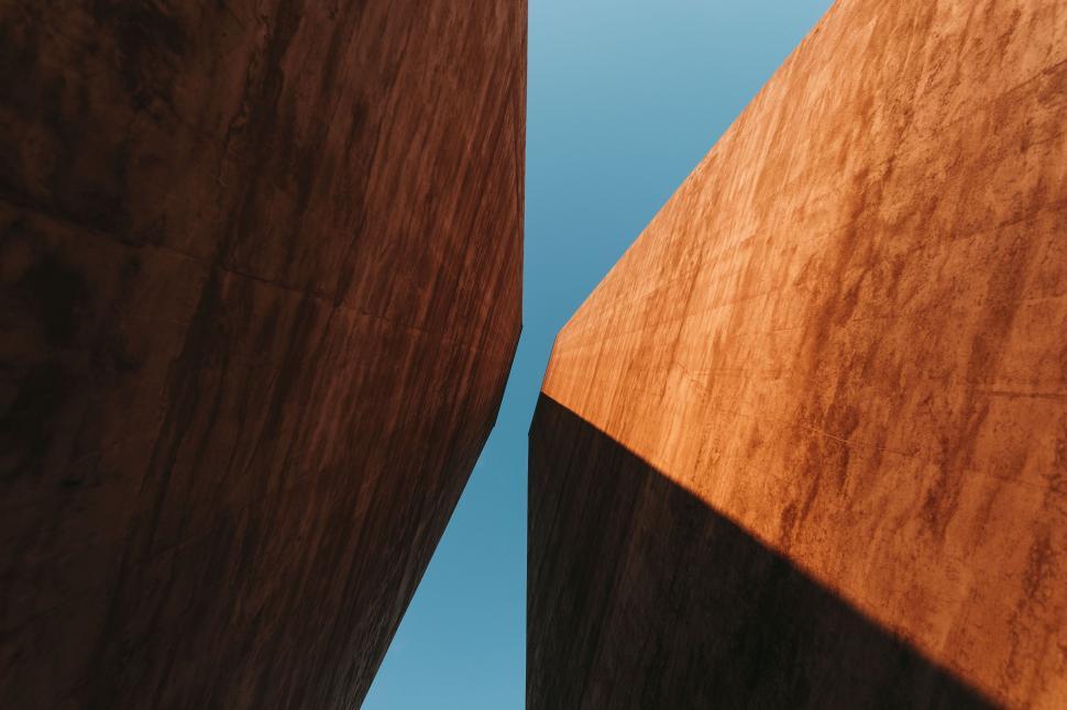 Free Image of Two Wooden Structures Against Blue Sky 