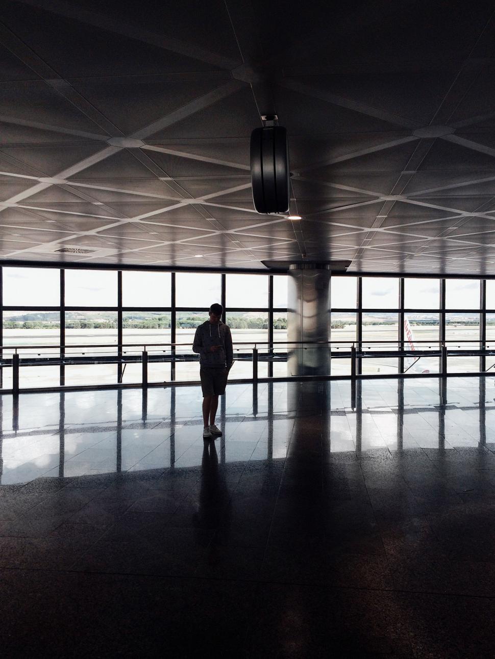 Free Image of Person Walking Through Airport 