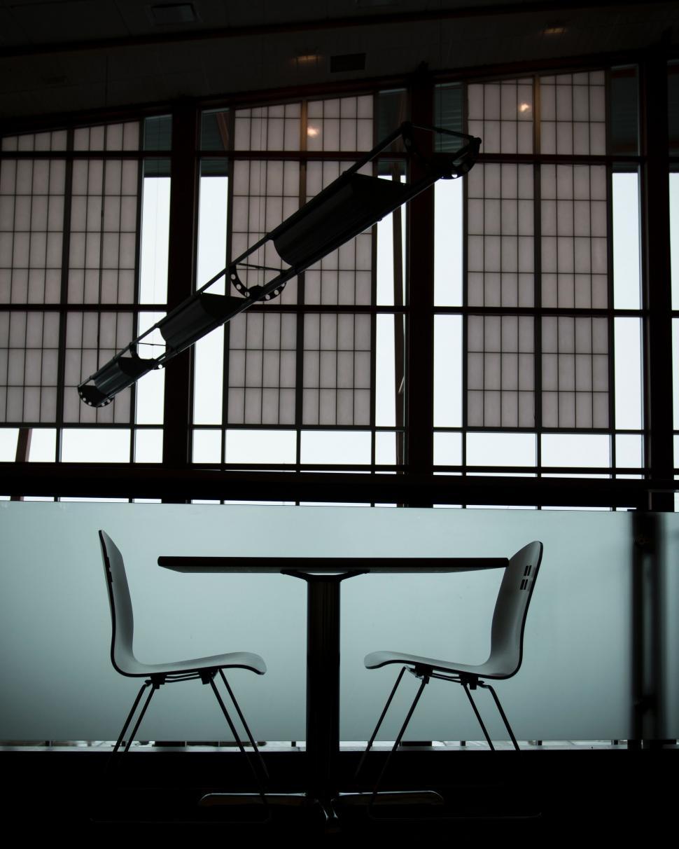 Free Image of Two Chairs and a Table in a Room 