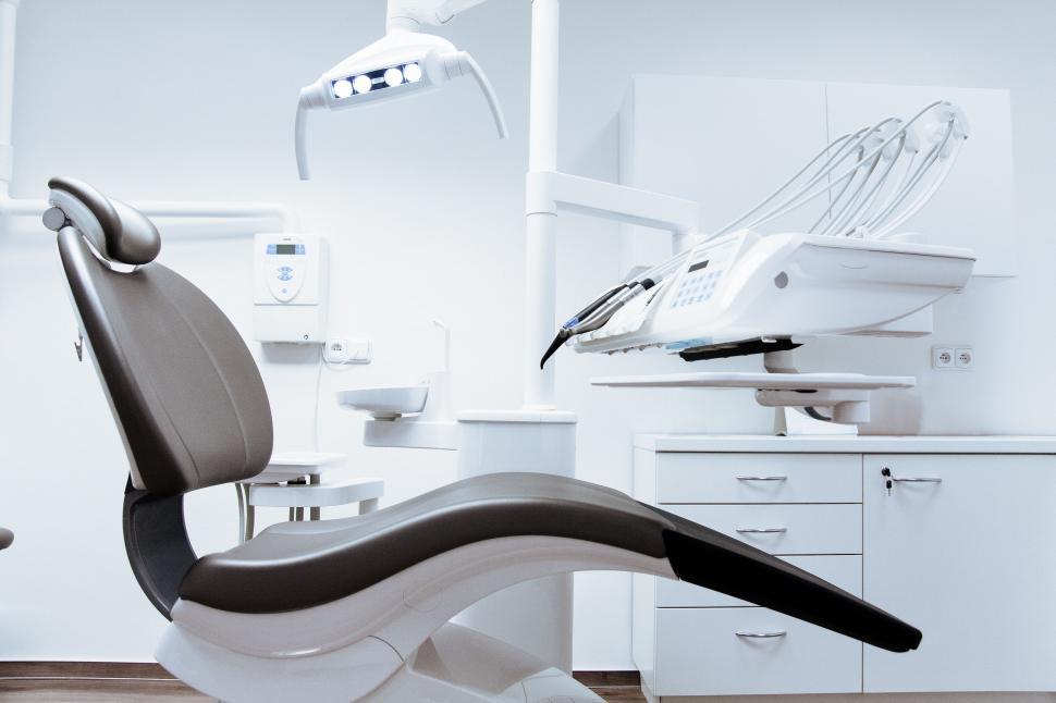 Free Image of Modern Dental Office With Dental Chair and Sink 