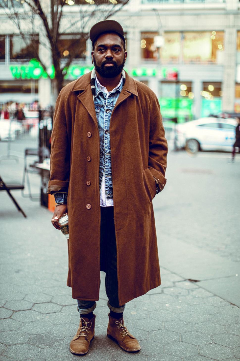 Free Image of Man Standing on Sidewalk in Brown Coat 