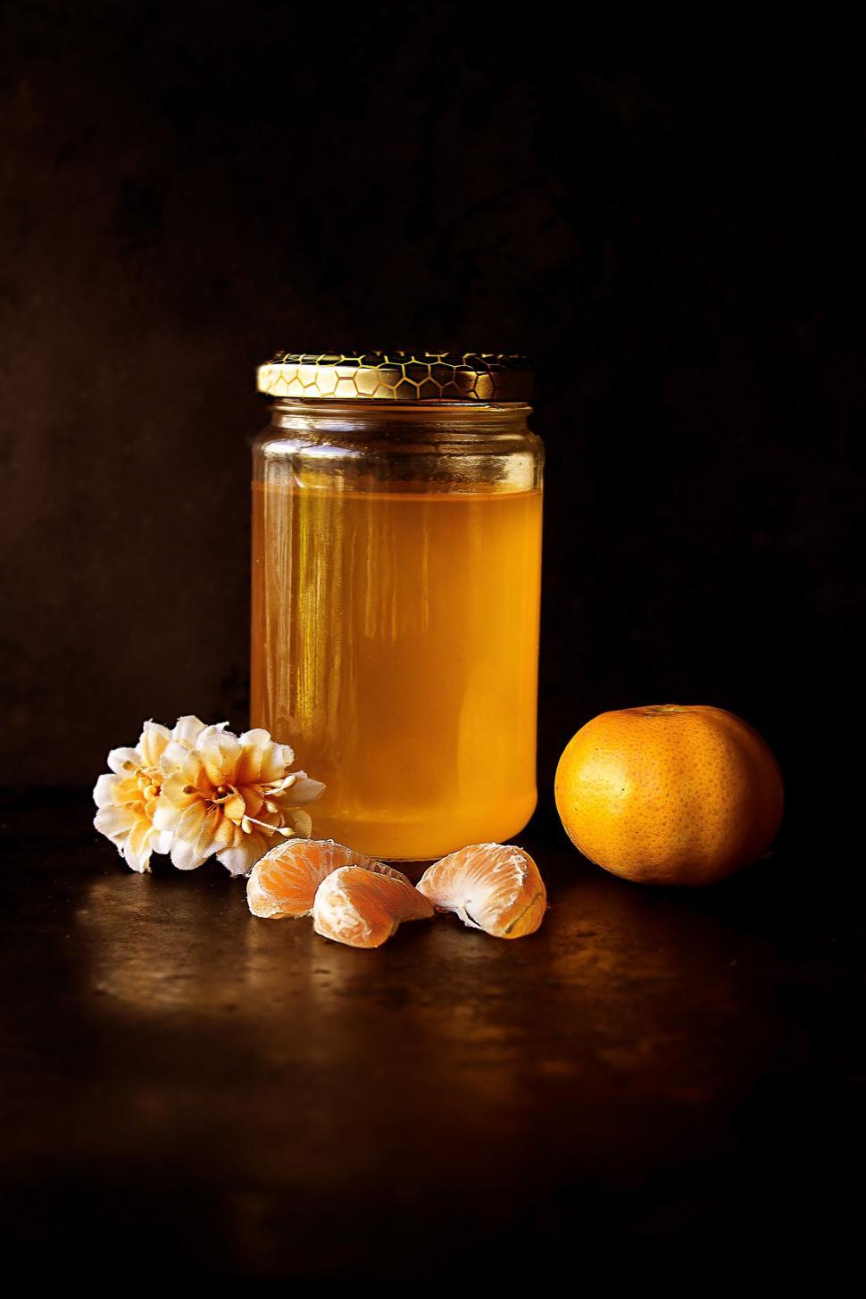 Free Image of Jar of Honey, Lemon, and Flowers 