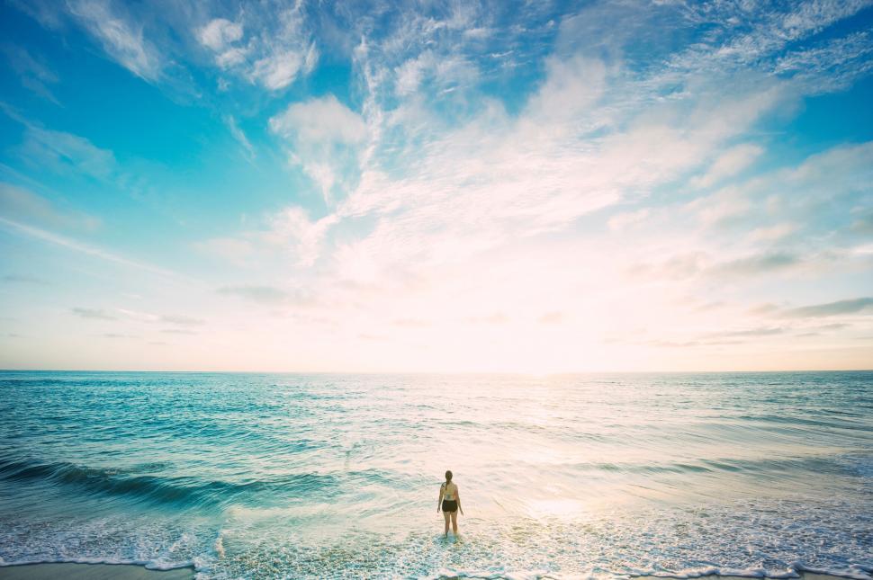 Free Image of Person Standing in Water at Beach 