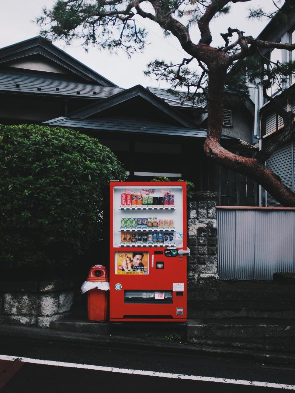 Free Image of Red Vending Machine on Side of Road 