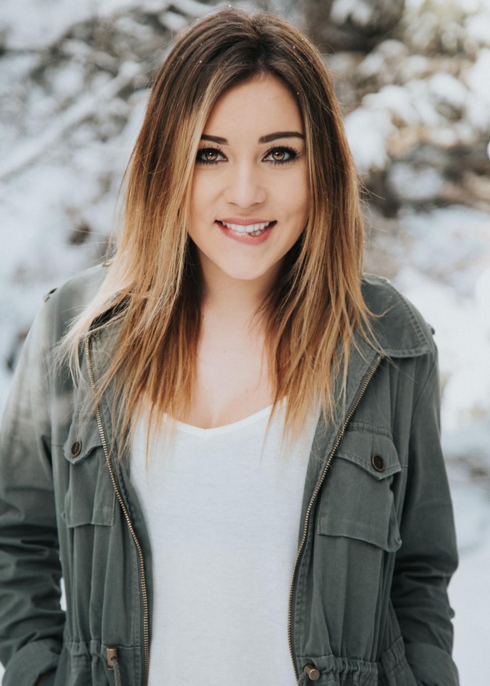 Free Image of Woman Smiling in Snow 