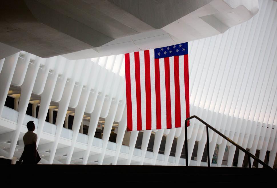 Free Image of American Flag Hanging From Ceiling of Building 
