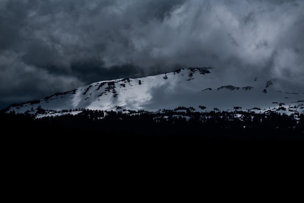 Free Image of Snow-covered Mountain Under Cloudy Sky 