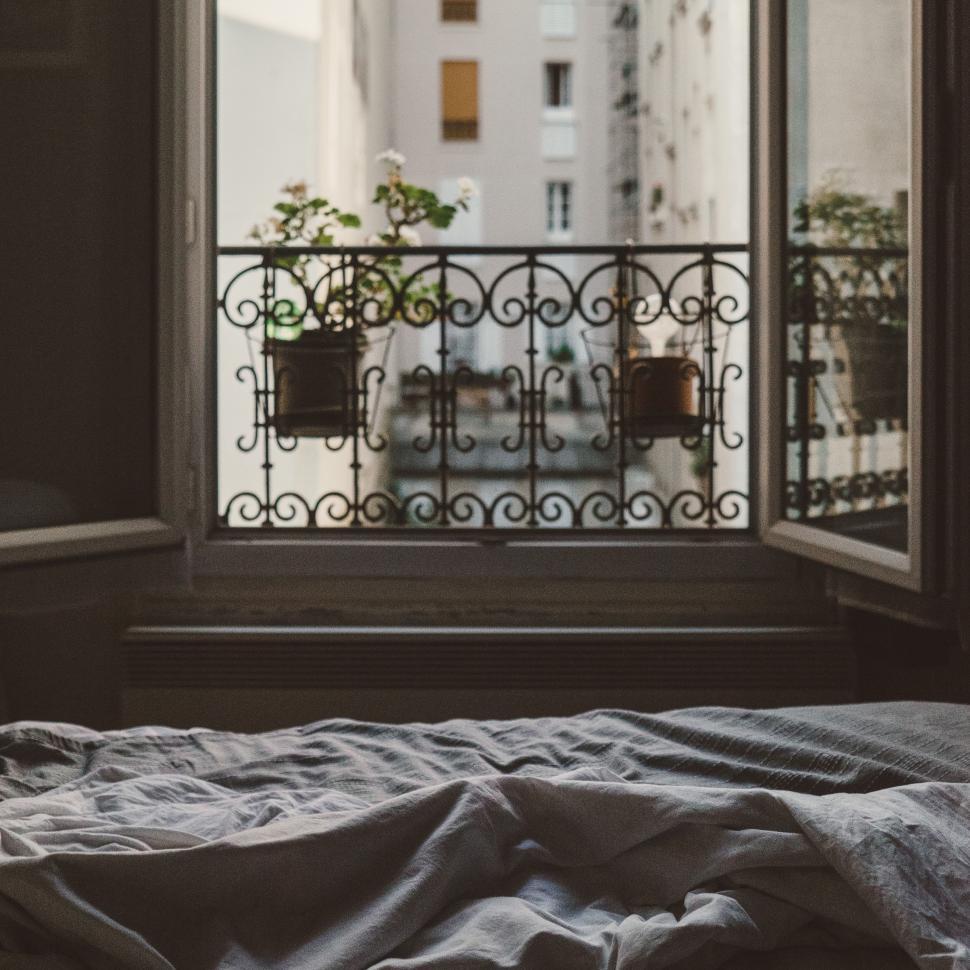 Free Image of Bed Positioned in Front of Window With Window Sill 