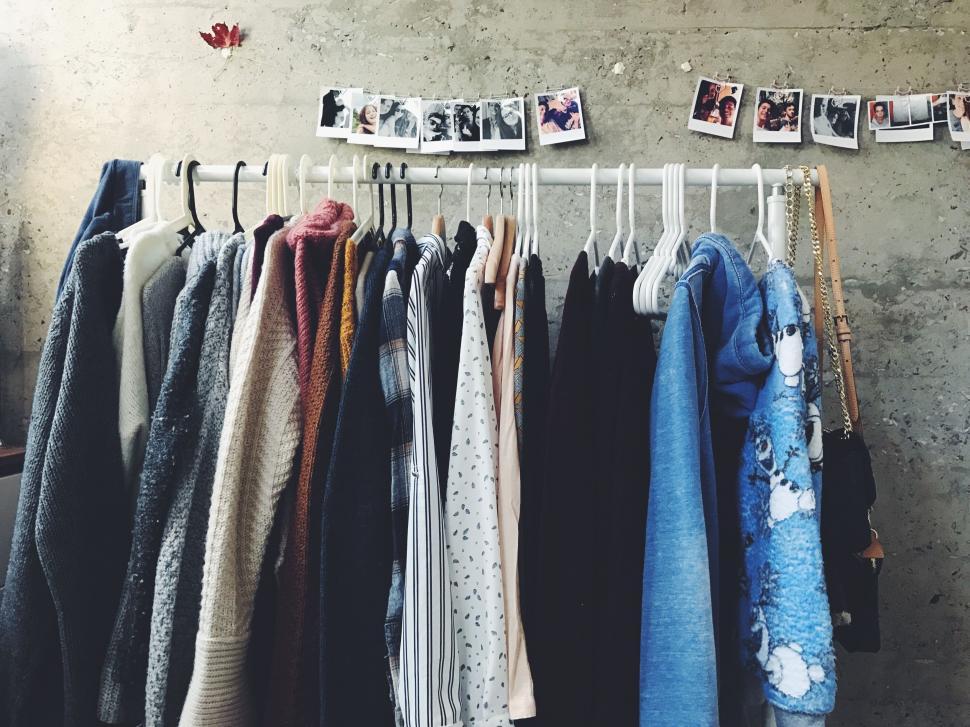 Free Image of Rack of Clothes Hanging on a Wall 
