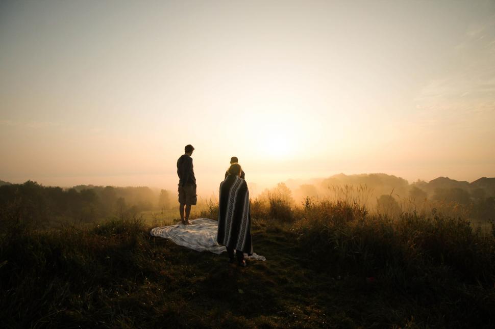 Free Image of Couple Standing on Top of Hill 