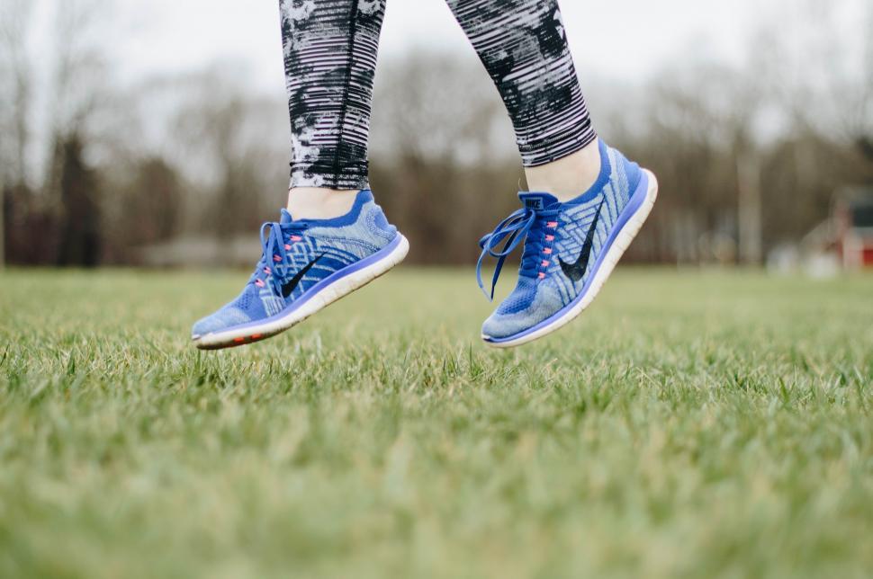 Free Image of Person Wearing Blue Tennis Shoes in Field 