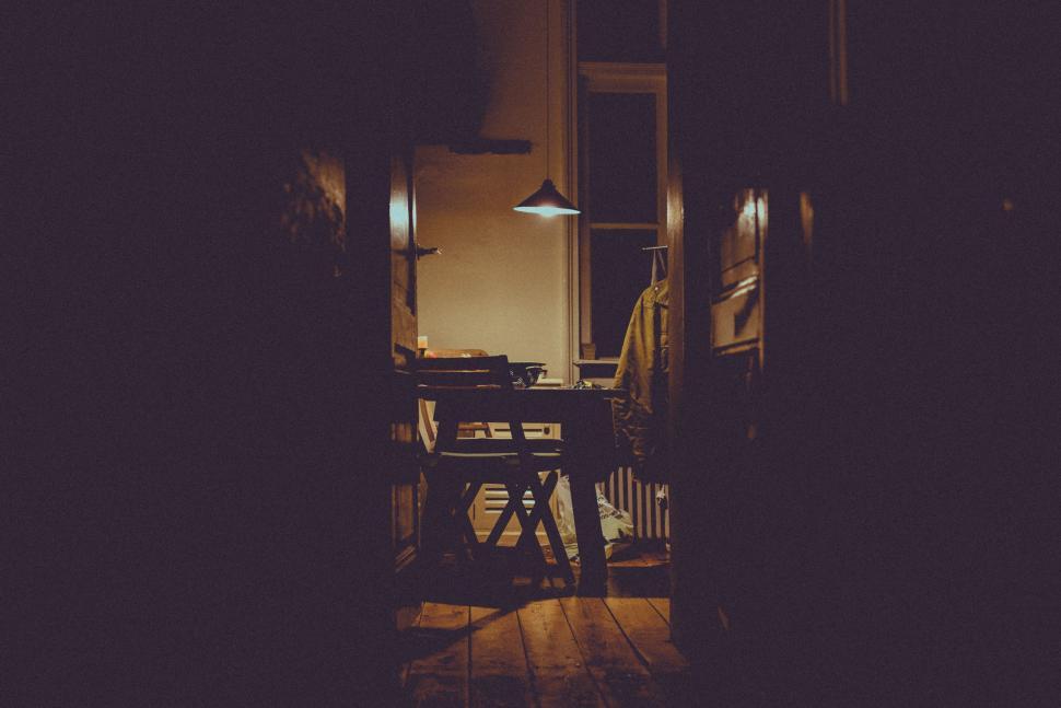 Free Image of Dark Room With Table and Chairs 
