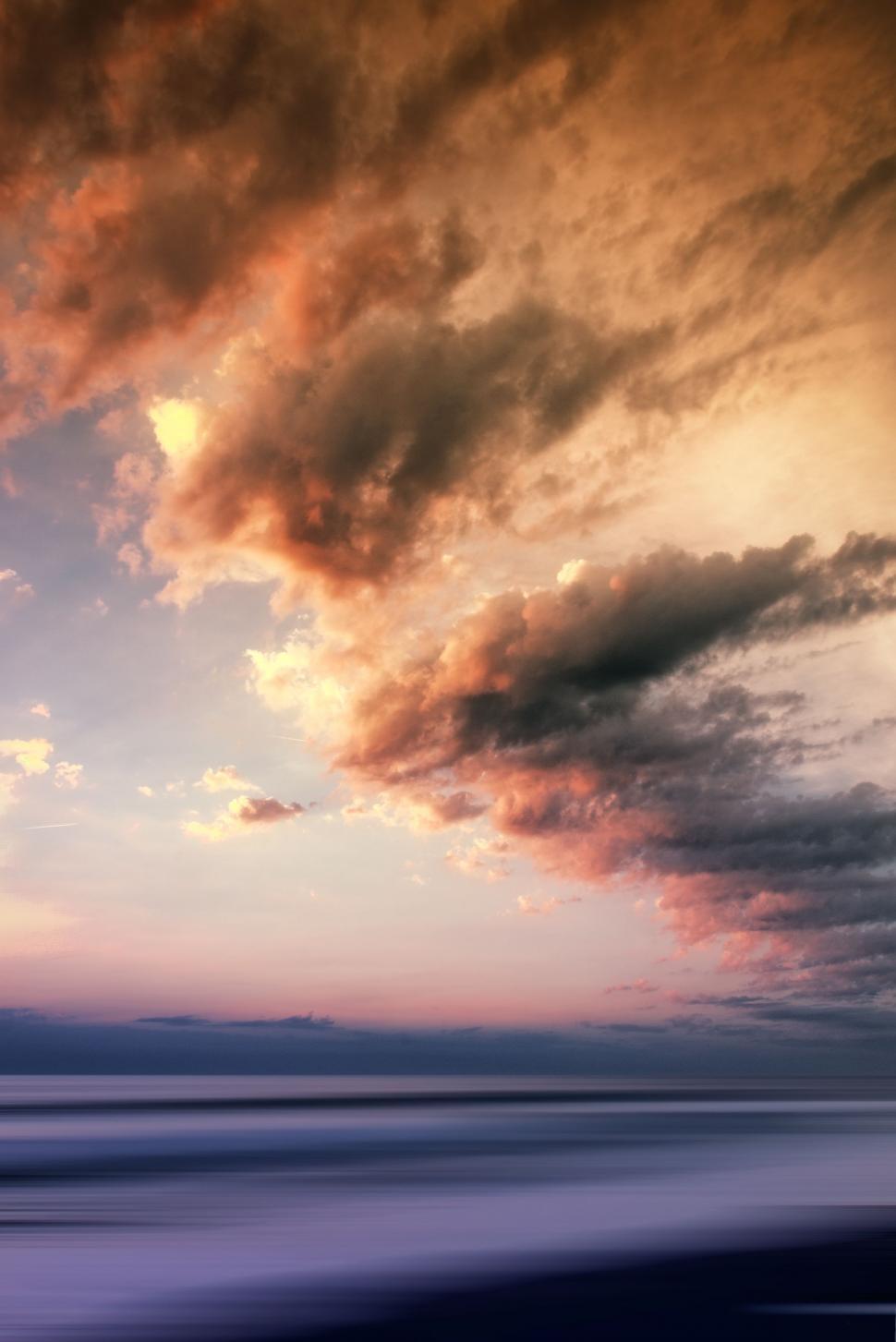 Free Image of Cloudy Sky Over Body of Water 