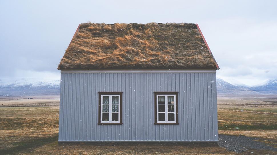 Free Image of Small House With Grass Roof and Two Windows 
