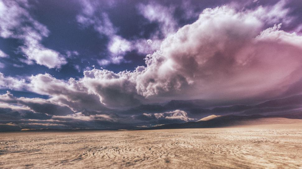 Free Image of Cloudy Sky Over Desert 