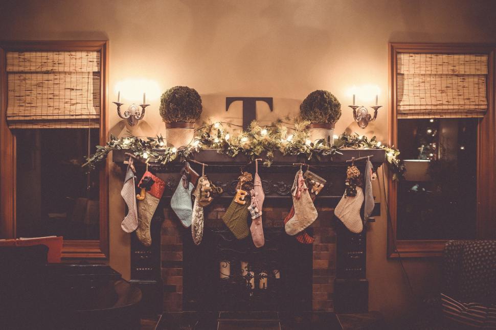 Free Image of Mantel Decorated With Stockings for Christmas 