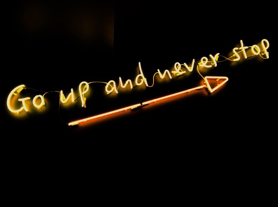 Free Image of Neon Sign Saying Go Up and Never Stop 