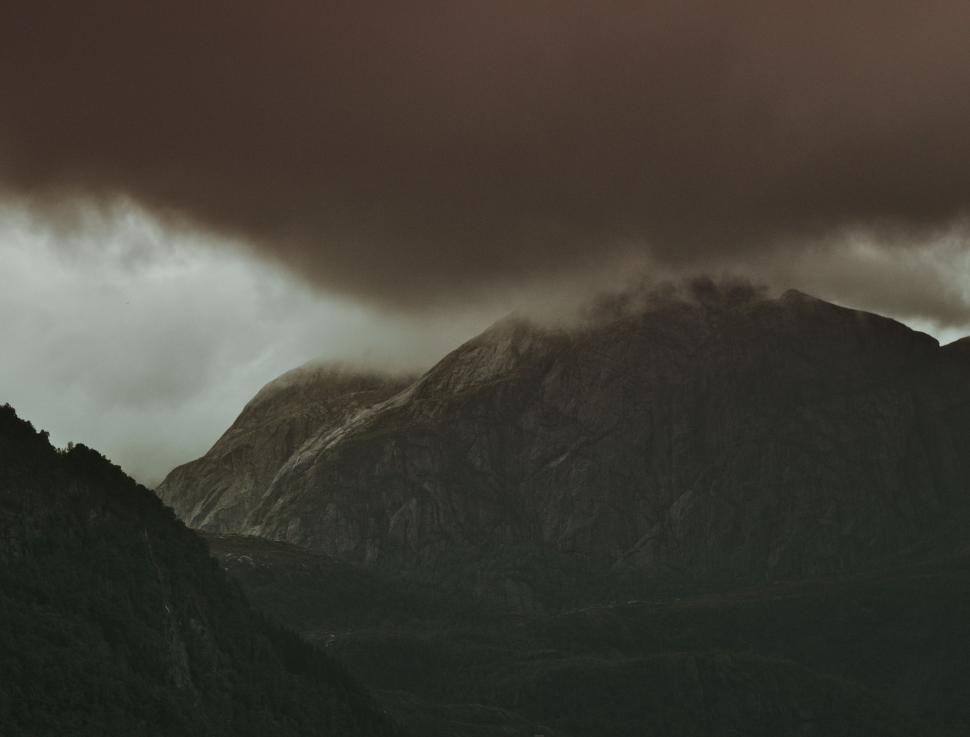 Free Image of Majestic Mountains Under Cloudy Sky 