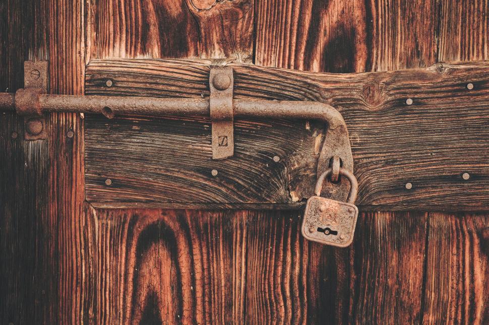 Free Image of Close Up of a Lock on a Wooden Door 