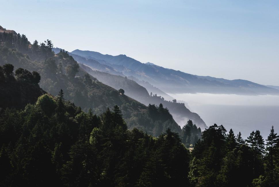 Free Image of Majestic Mountain Shrouded in Fog 