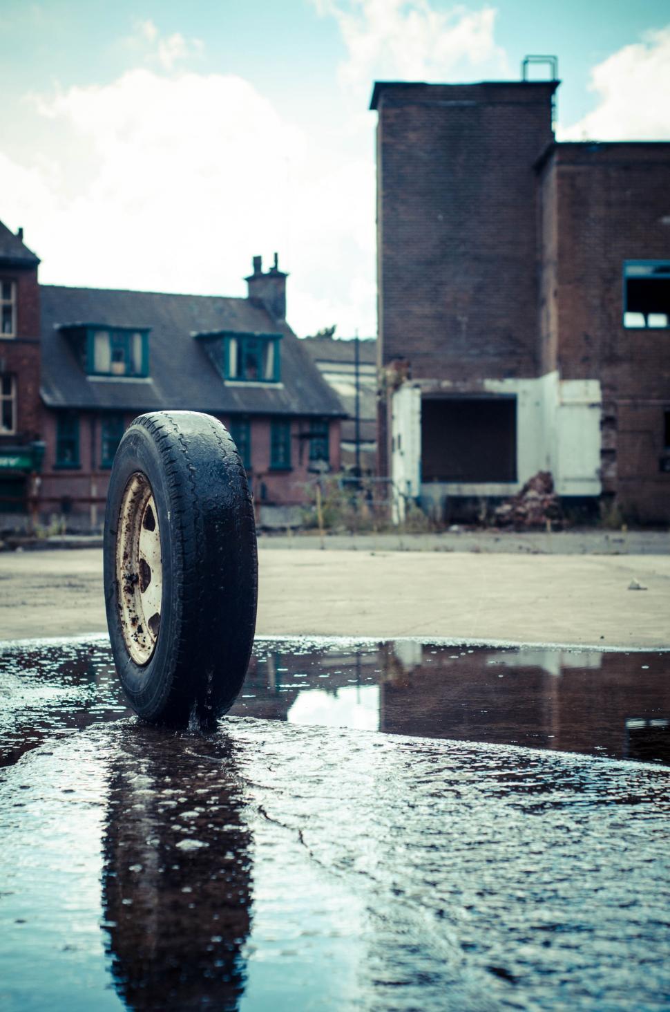 Free Image of Tire on Puddle of Water 