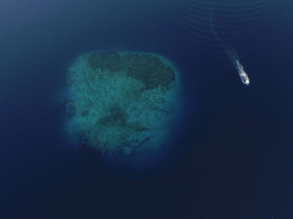 Free Image of Small Island in the Middle of the Ocean 
