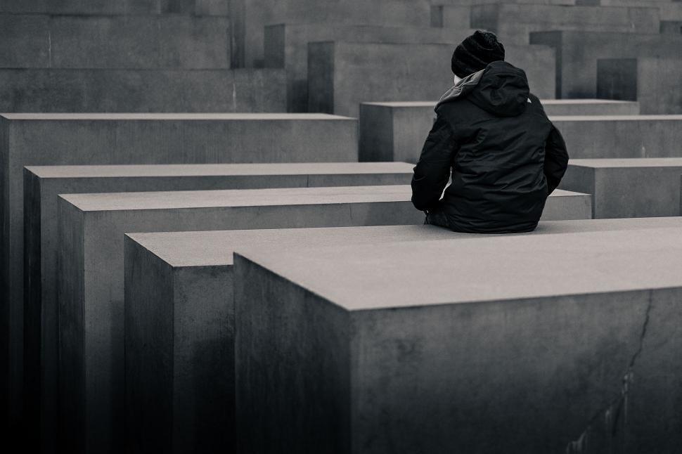 Free Image of Person Sitting on Bench in Cemetery 