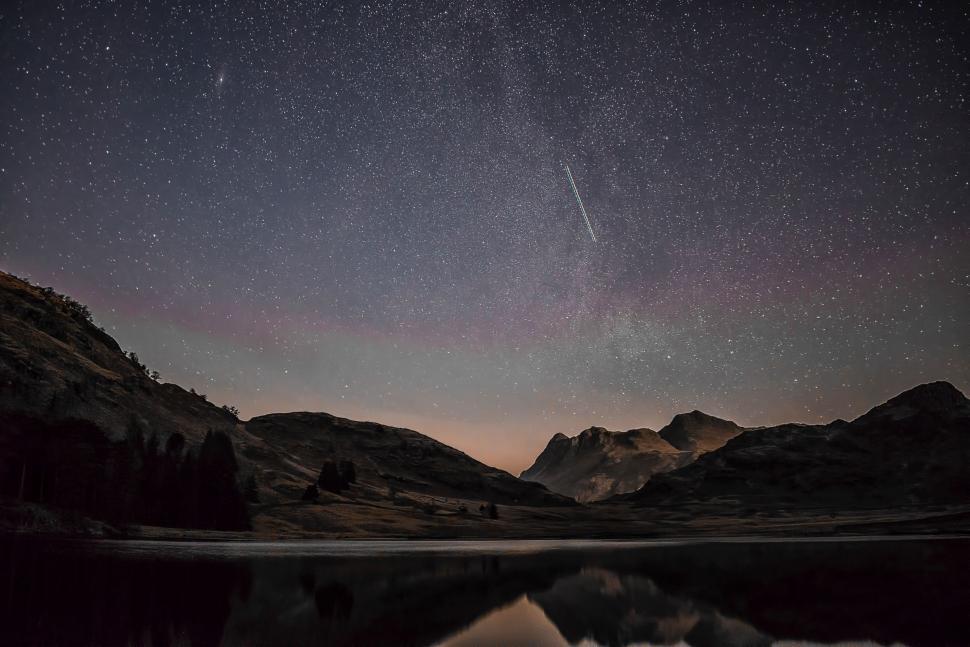 Free Image of Starry Night Sky Above Mountain Lake 