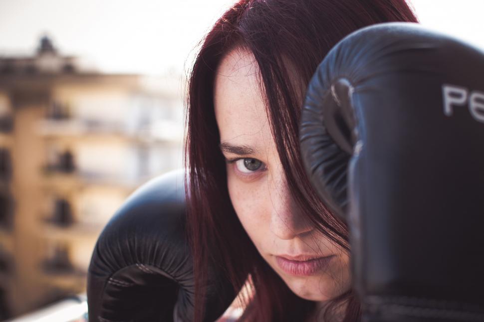 Free Image of Woman With Long Hair Wearing Boxing Gloves 