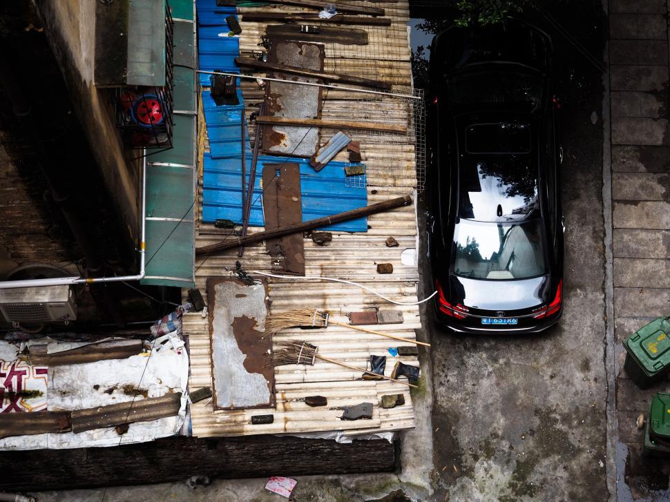 Free Image of Aerial View of a Car Parked in an Alley 