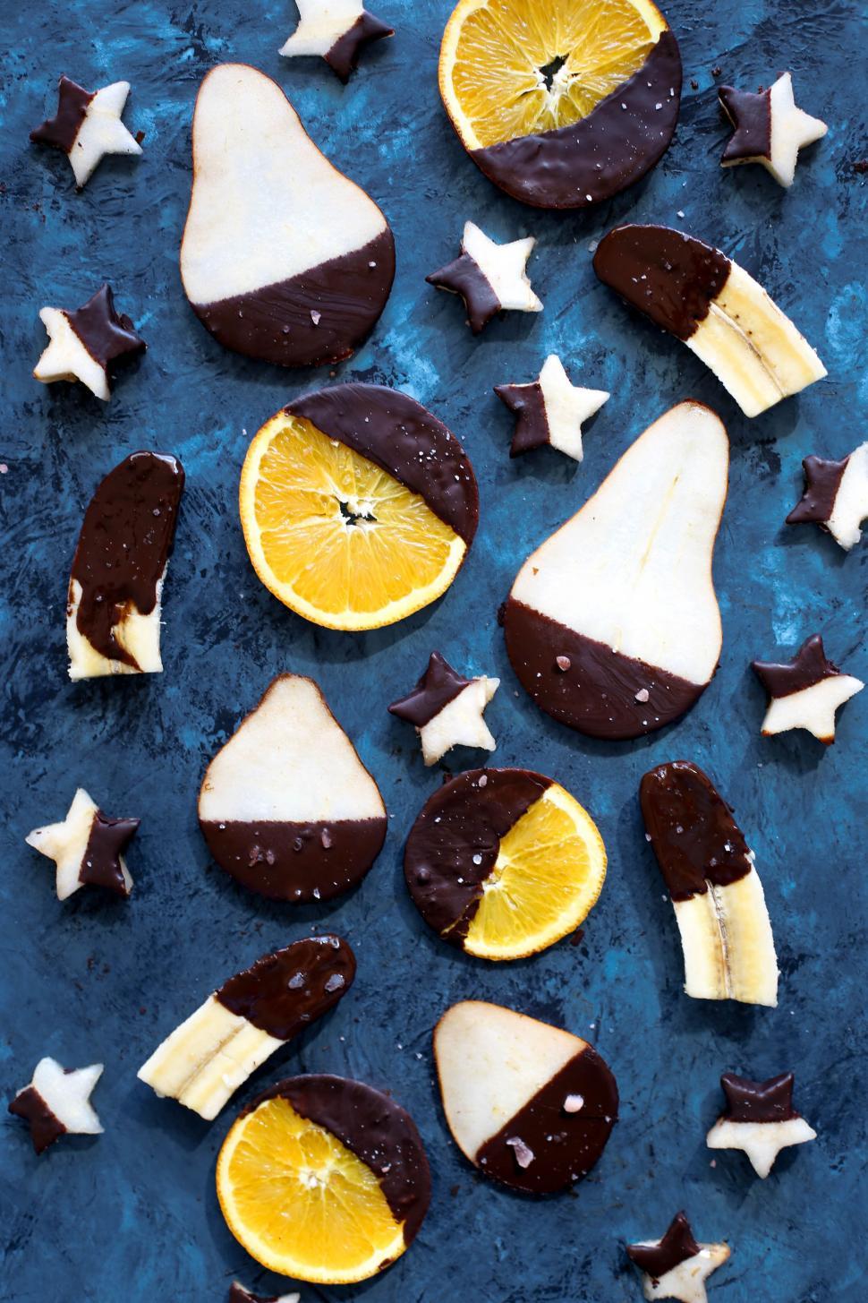 Free Image of Table With Cookies and Orange Slices 