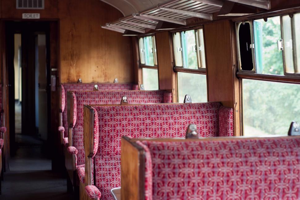 Free Image of Inside of a Train With Pink Seats 