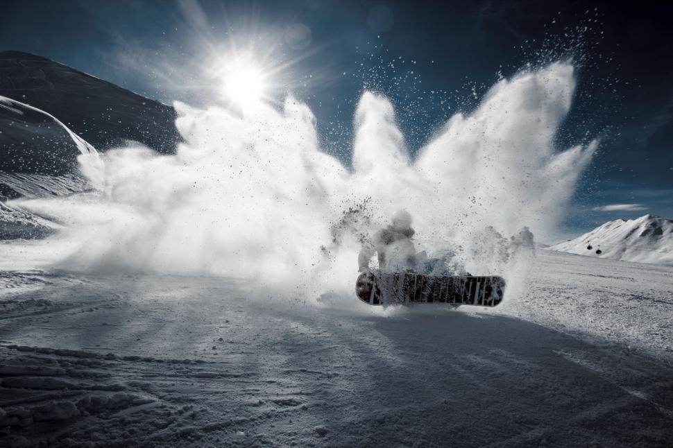 Free Image of Snowmobile Kicking Up Snow on Snowy Mountain 
