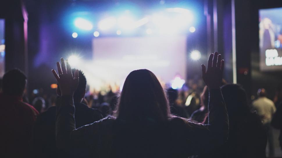 Free Image of Energetic Crowd at Concert With Hands Raised 