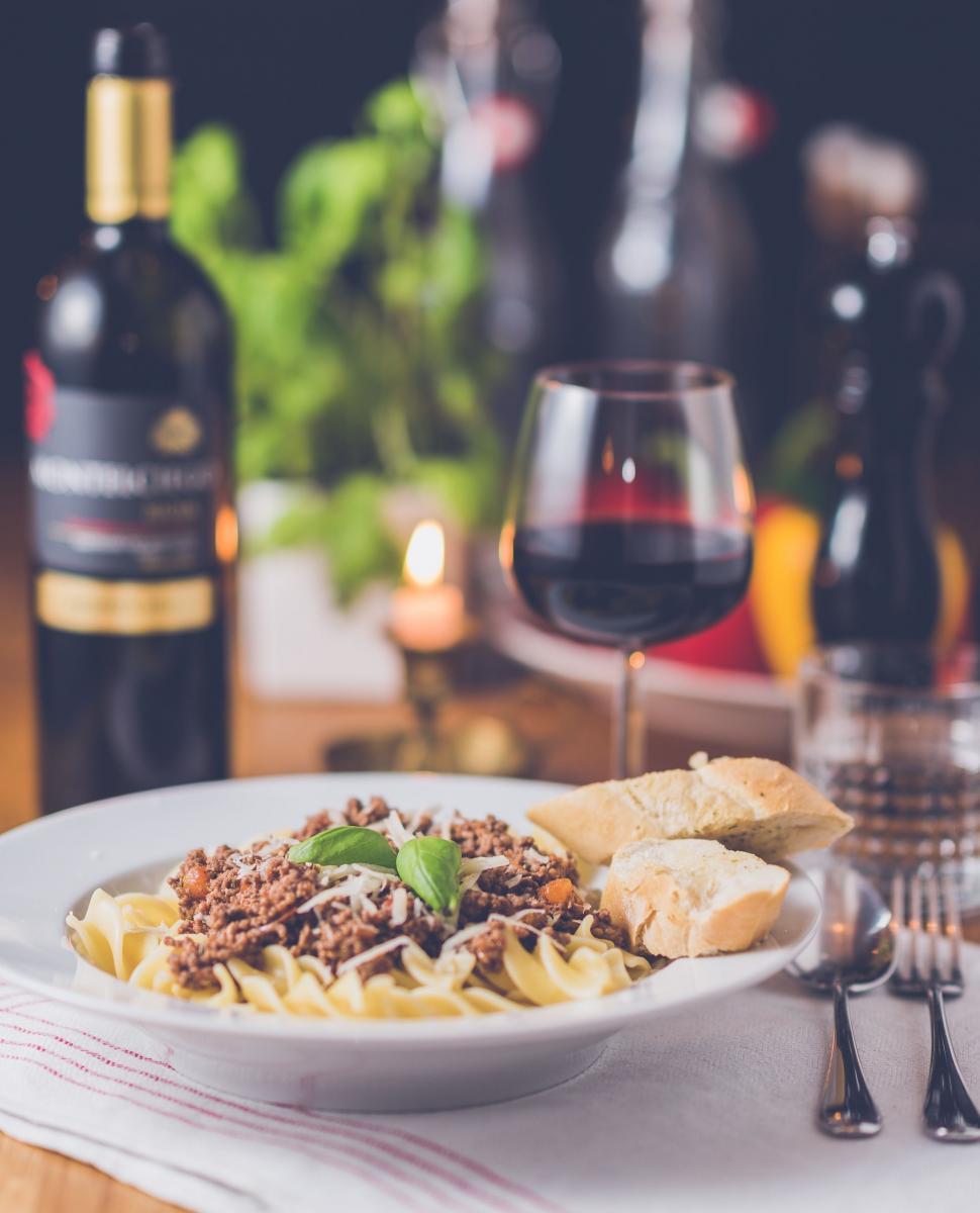 Free Image of Plate of Food and Glass of Wine on Table 