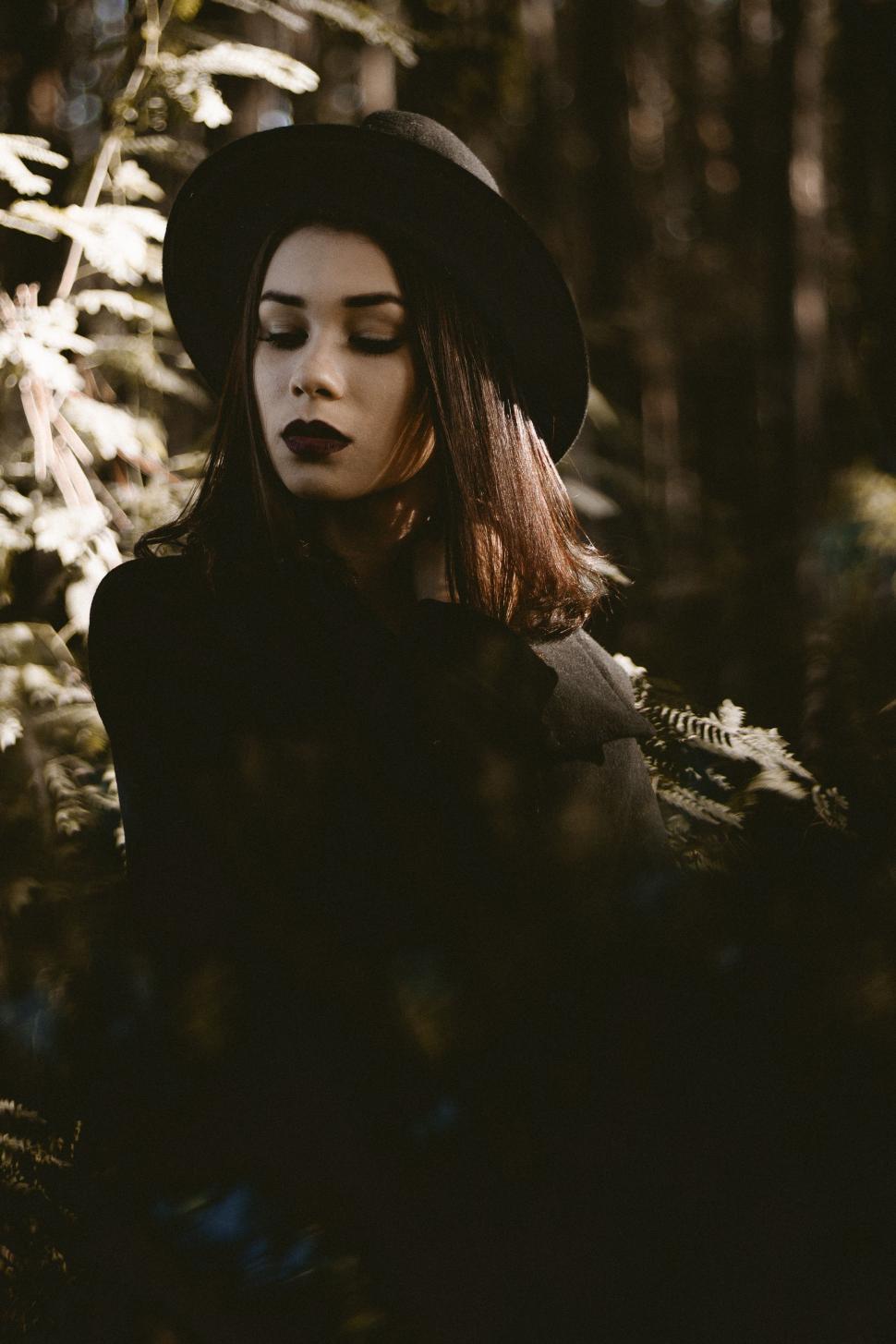 Free Image of Woman Wearing Hat in Woods 