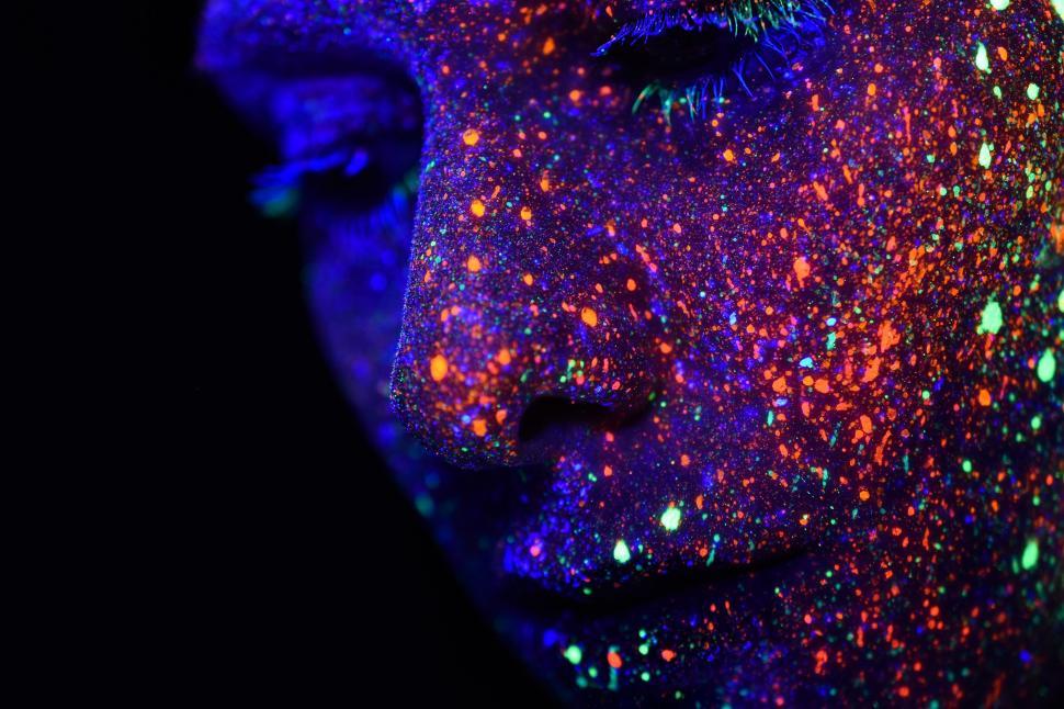 Free Image of Womans Face Covered in Colorful Powder 