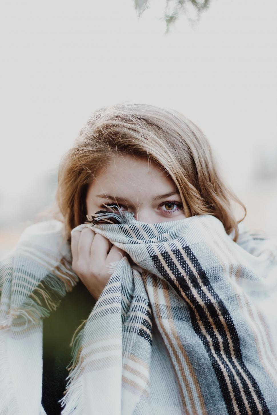 Free Image of Woman Covering Face With Blanket 
