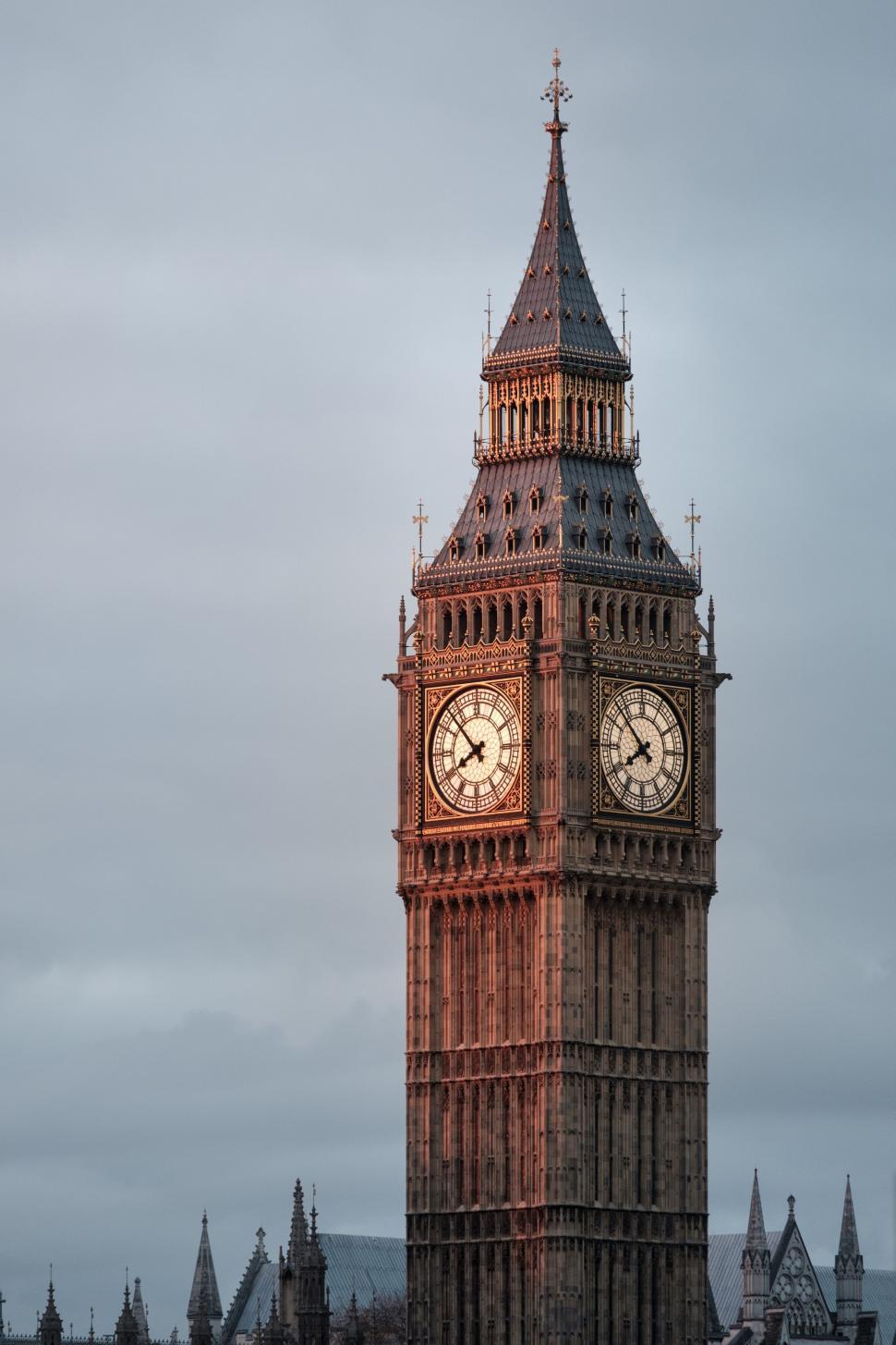 Free Image of Clock Tower Overlooking Cityscape 
