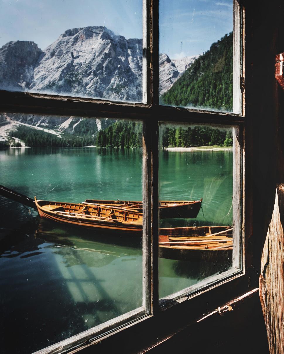Free Image of Window Overlooking Lake With Boat 