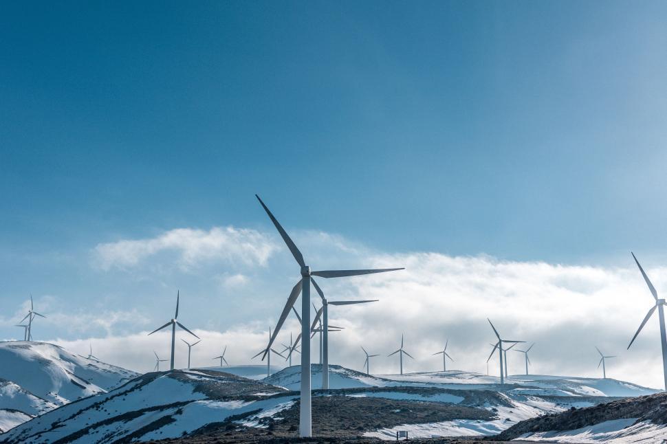 Free Image of Group of Wind Turbines on Snowy Hill 