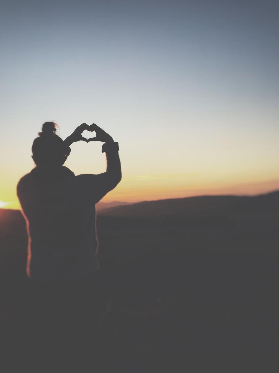 Free Image of Man Making Heart Shape With Hands 